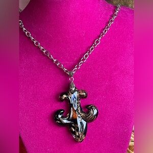 Murano glass lampwork pendant in a stylized Fleur de Lis design.